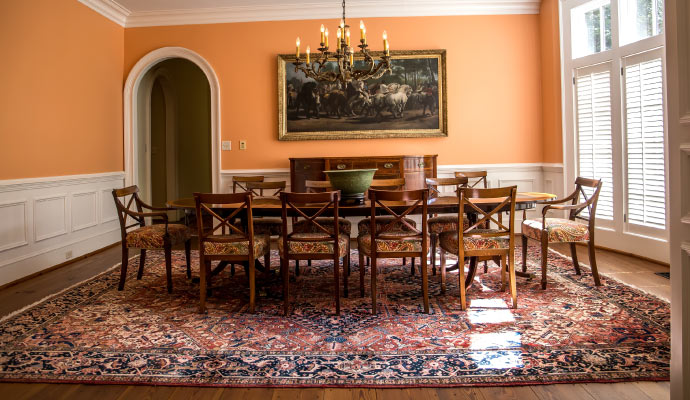 dinning room floor is covered by a patterned clean area rug