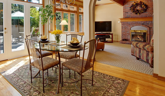 well ventilated dining room allowing ample natural light and offering a view of an outdoor patio