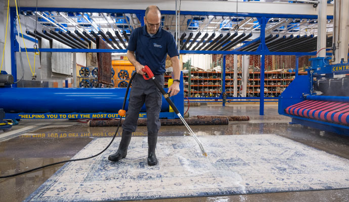 Professional rug cleaning using equipment